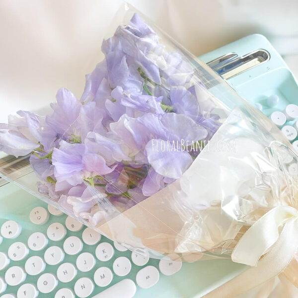 Sweet Pea Bouquet Resting on Keyboard